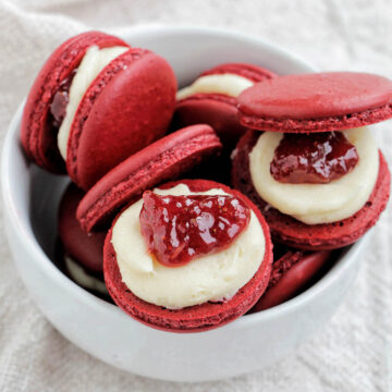 strawberry macarons in a bowl.