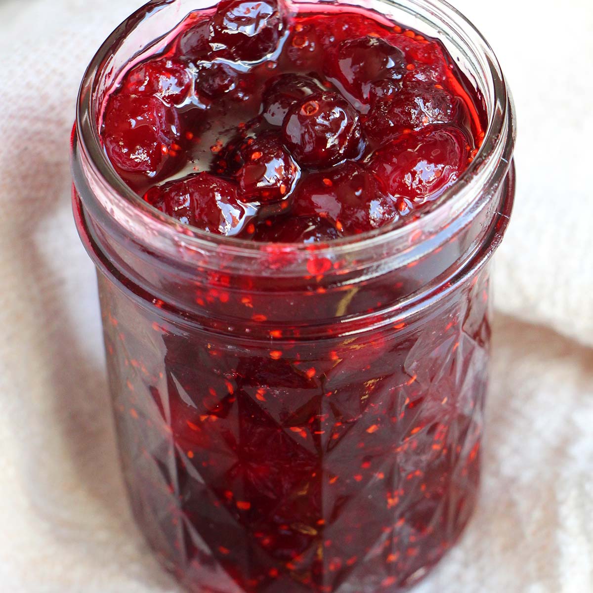 cranberry jam in a mason jar.