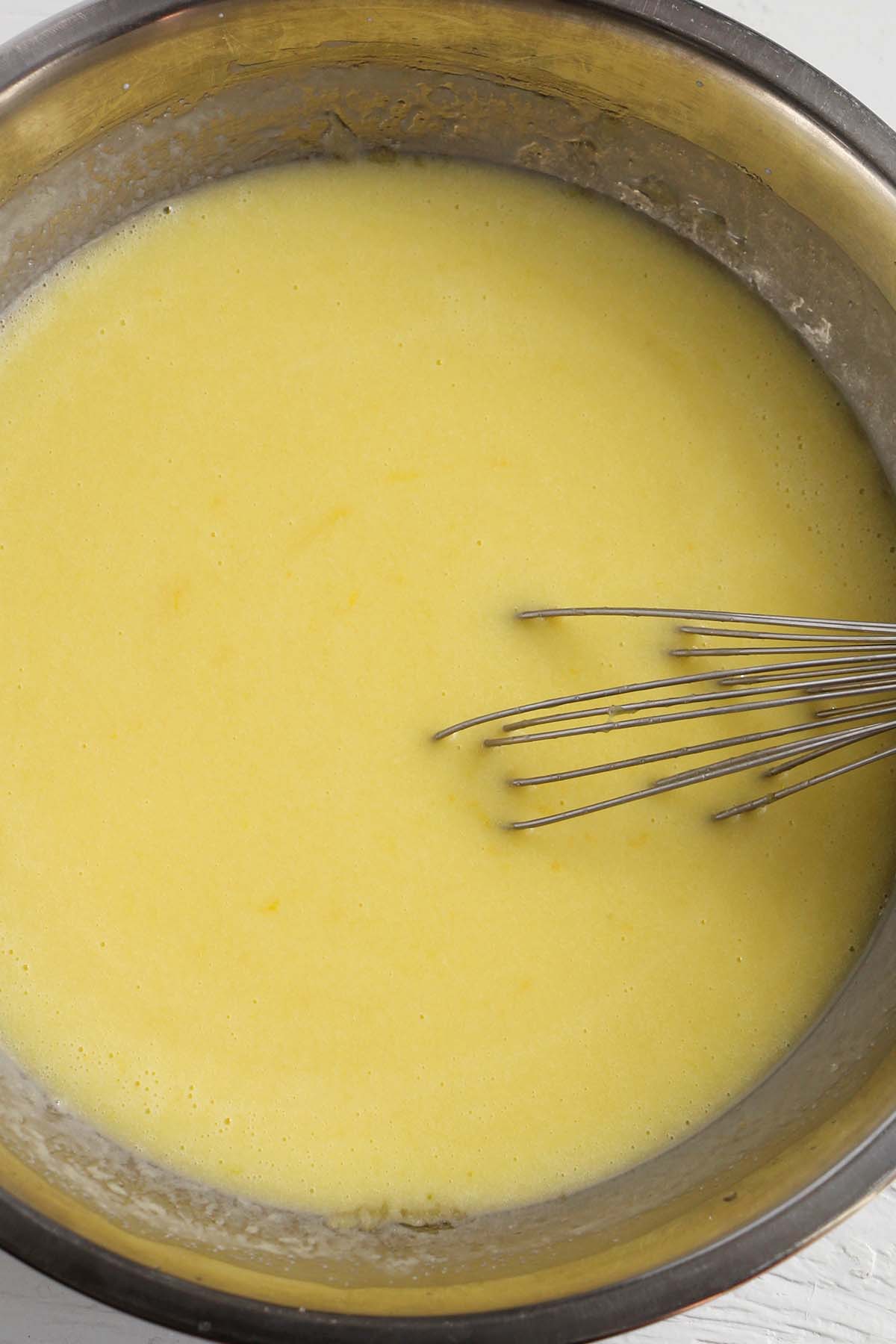 lemon olive oil cake batter with whisk.