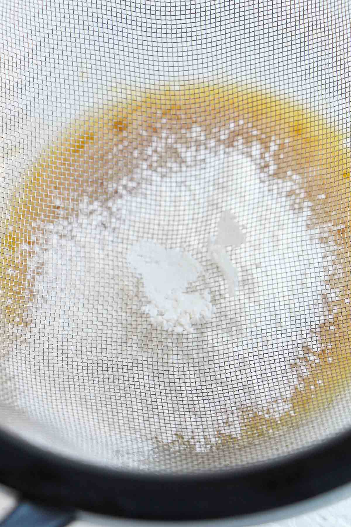 sifting flour into lava cake batter.