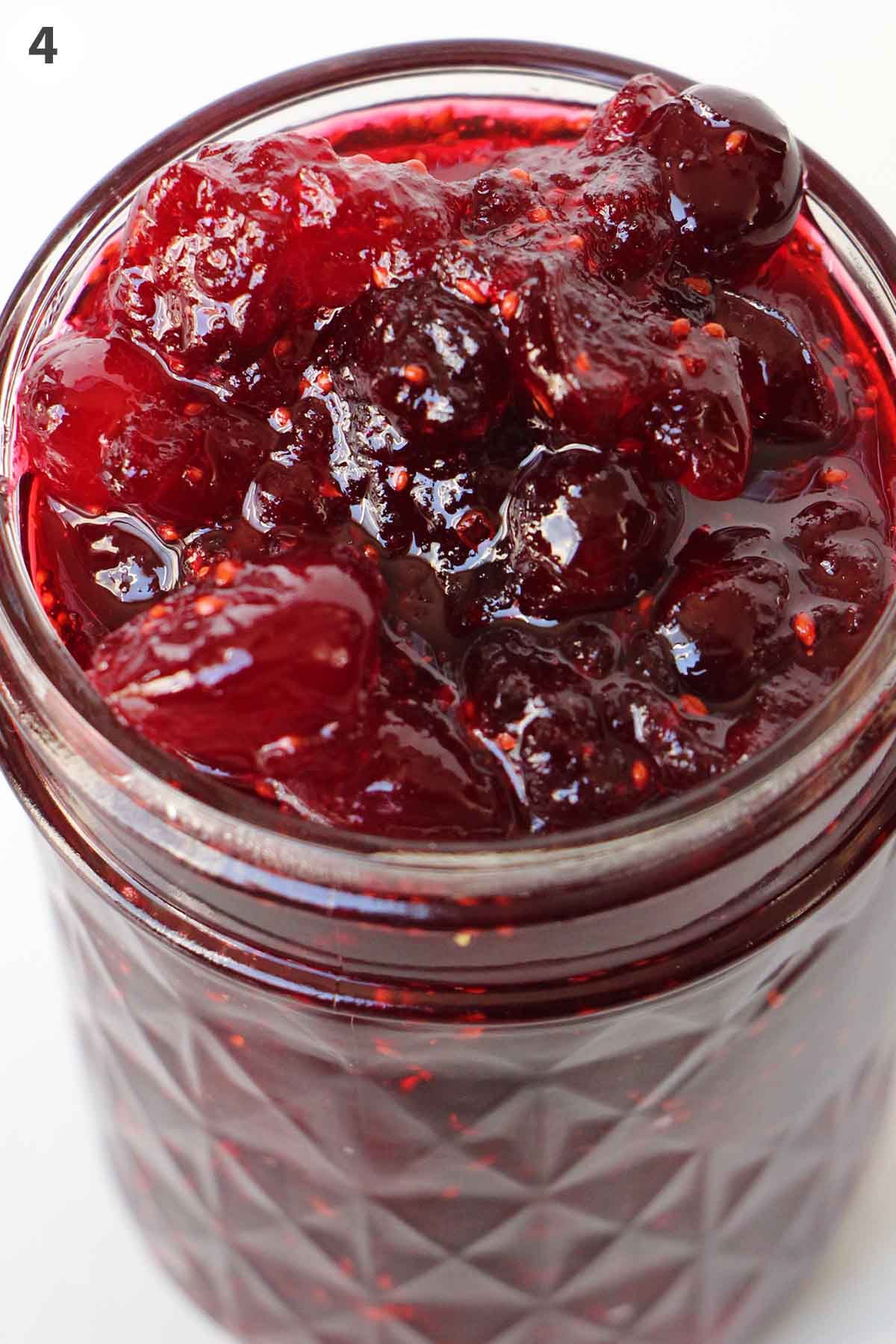 numbered photo with cranberry jam in a jar.