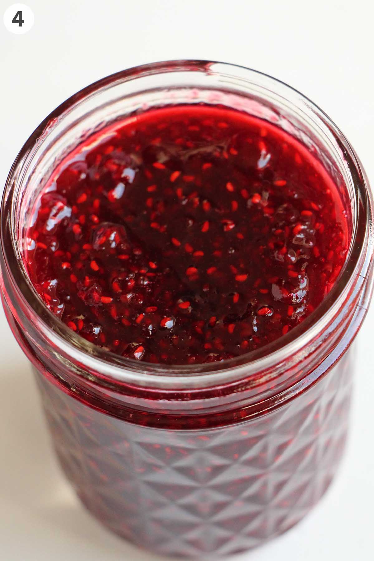 numbered photo with raspberry jam in a jar.
