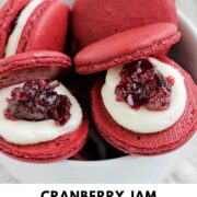 cranberry jam macarons in a bowl with text overlay.