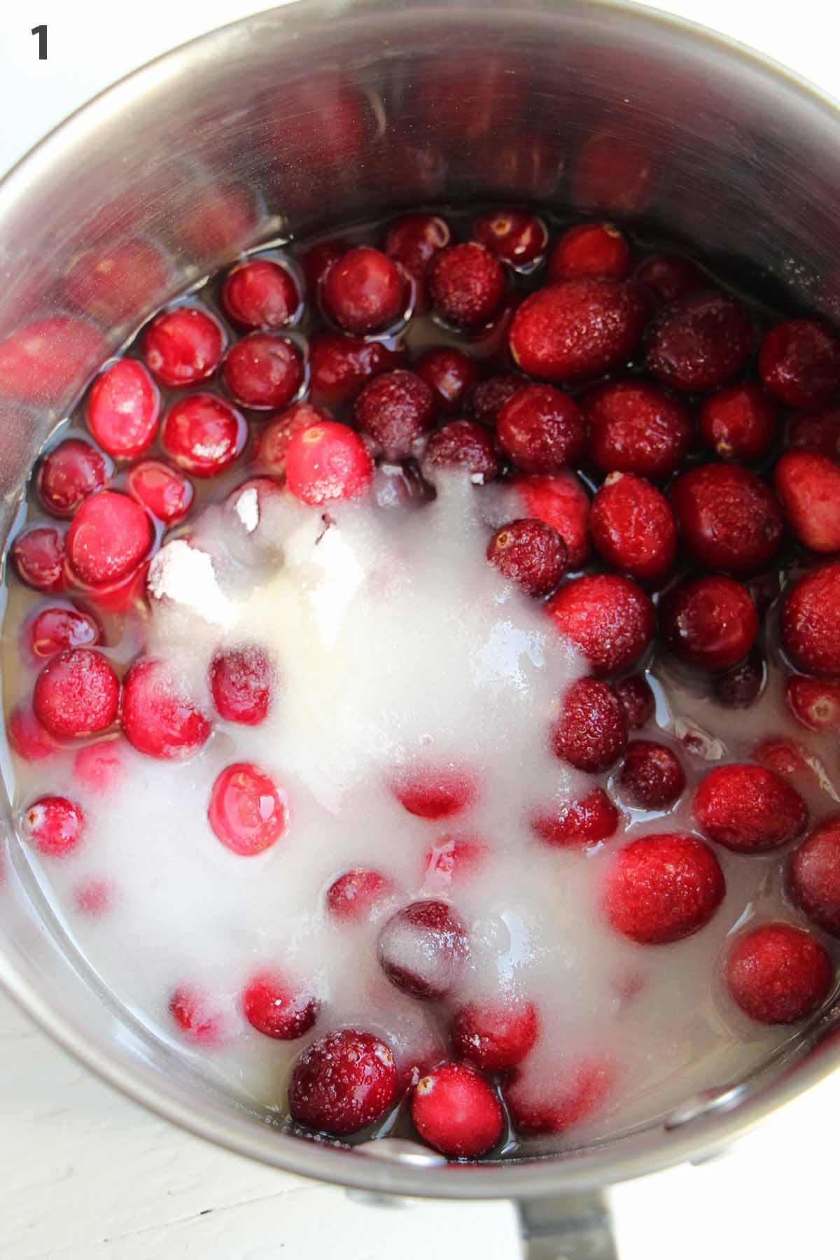 numbered photo with cranberries and sugar in a pot.