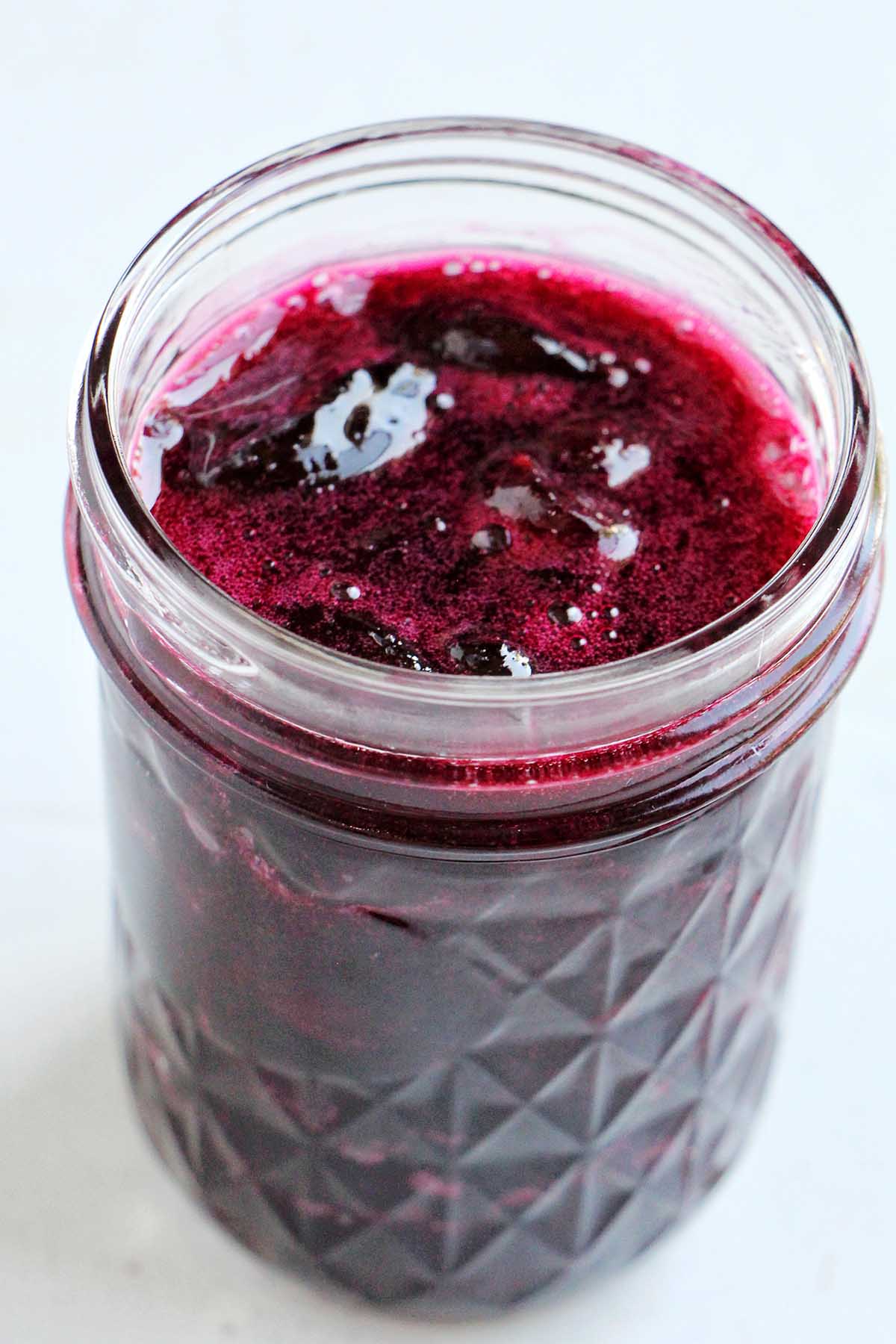 cherry jam in mason jar.