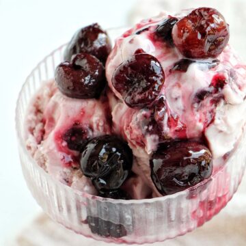 black cherry ice cream in coupe glass.
