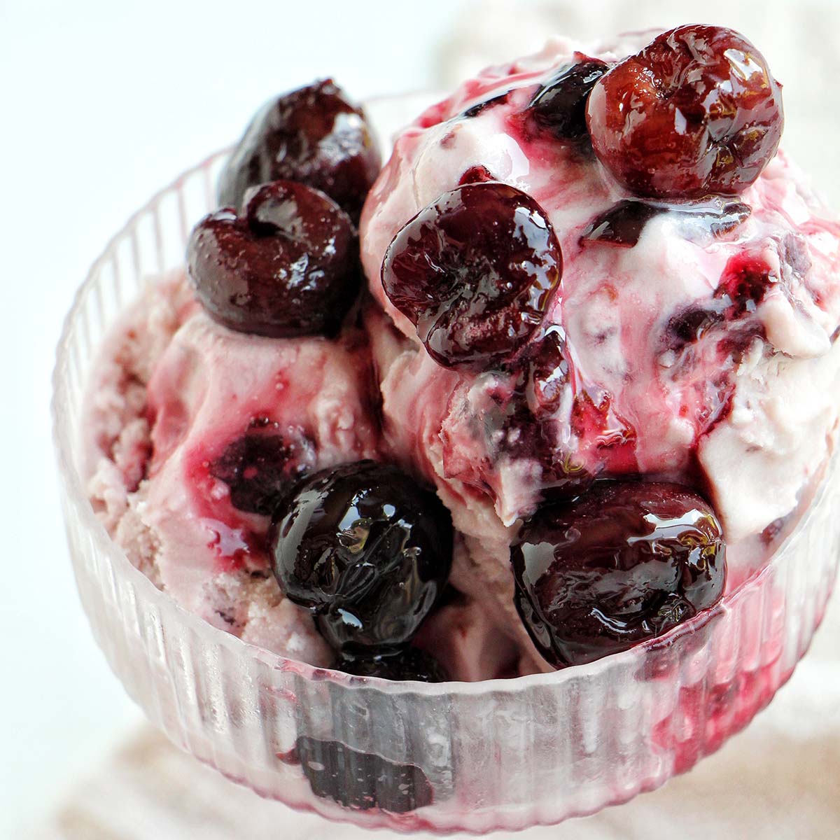 black cherry ice cream in coupe glass.