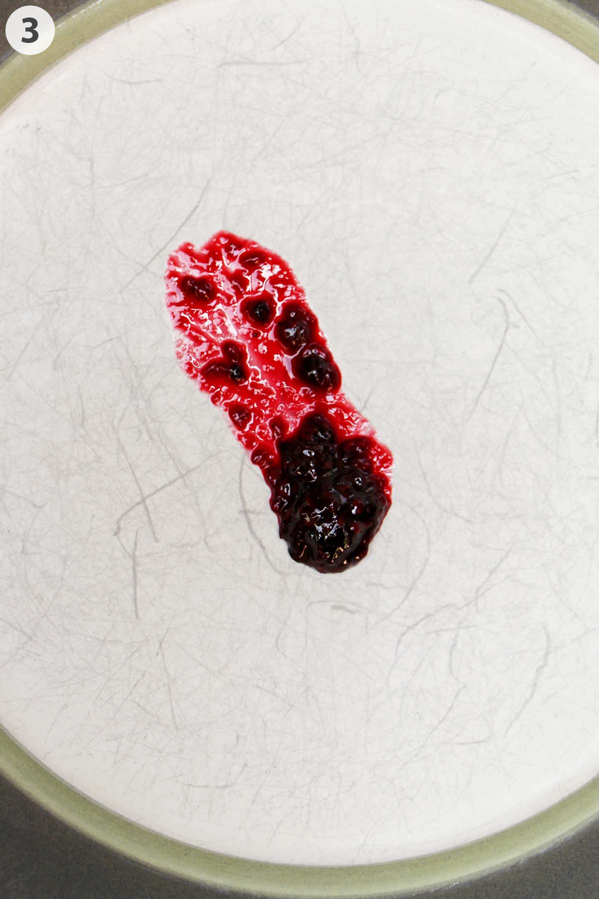 numbered photo showing blackberry jam on a plate.