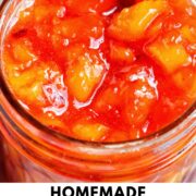 jar of peach jam with text overlay.