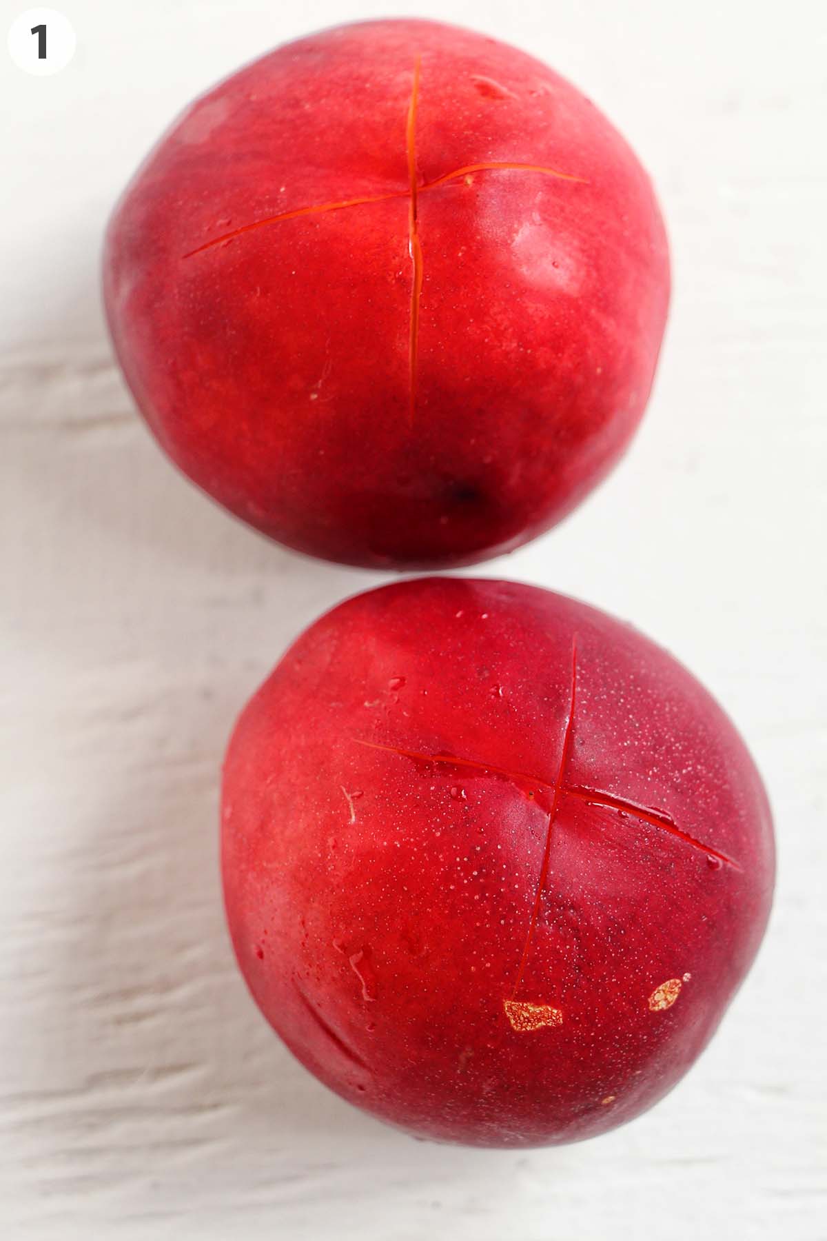 numbered photo showing X in the bottom of nectarines.