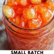 nectarine jam in mason jar with text overlay.