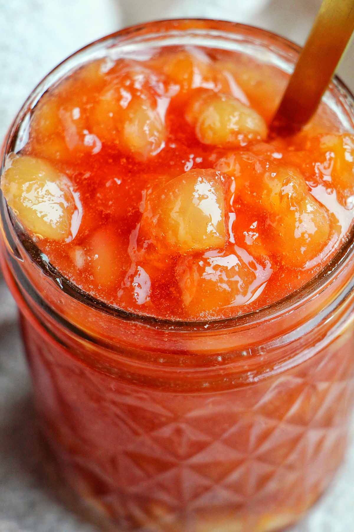 nectarine jam in a mason jar.