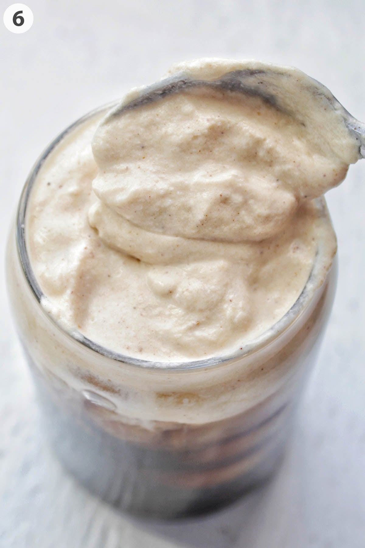 numbered photo showing spooning pumpkin cold foam on cold brew.