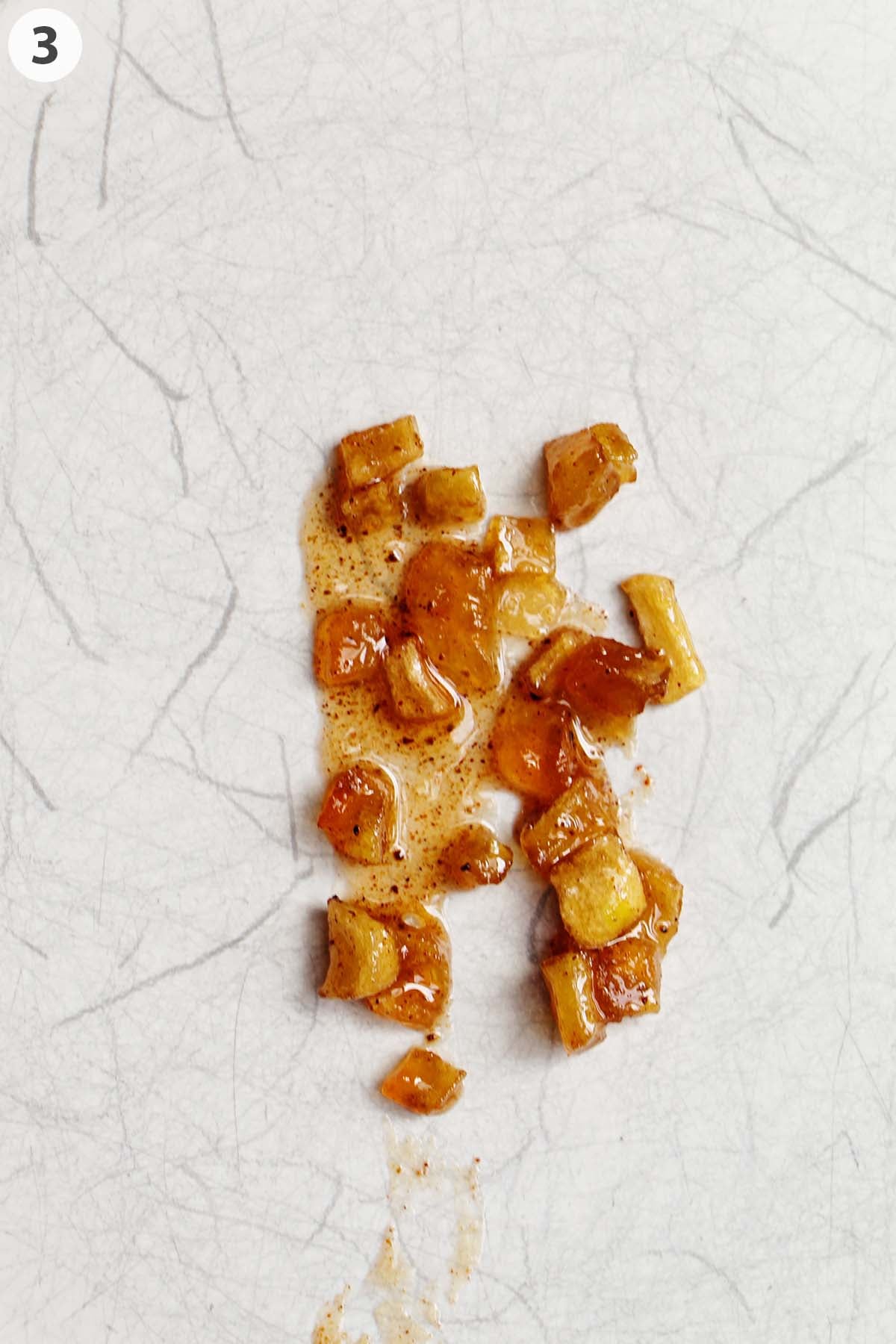 numbered photo of apple jam on cold plate.